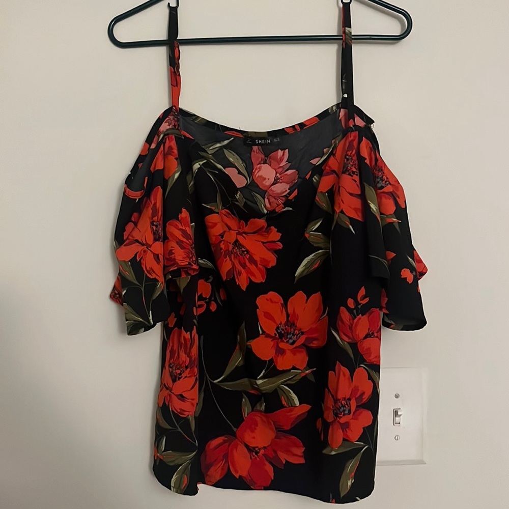 Red flower flows top